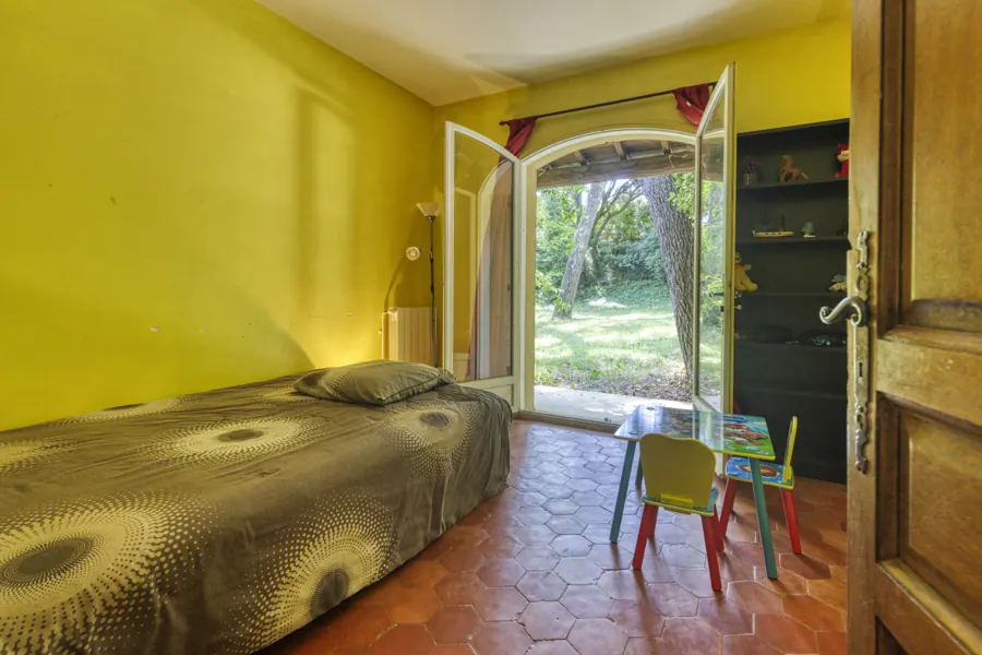 A bedroom with garden access