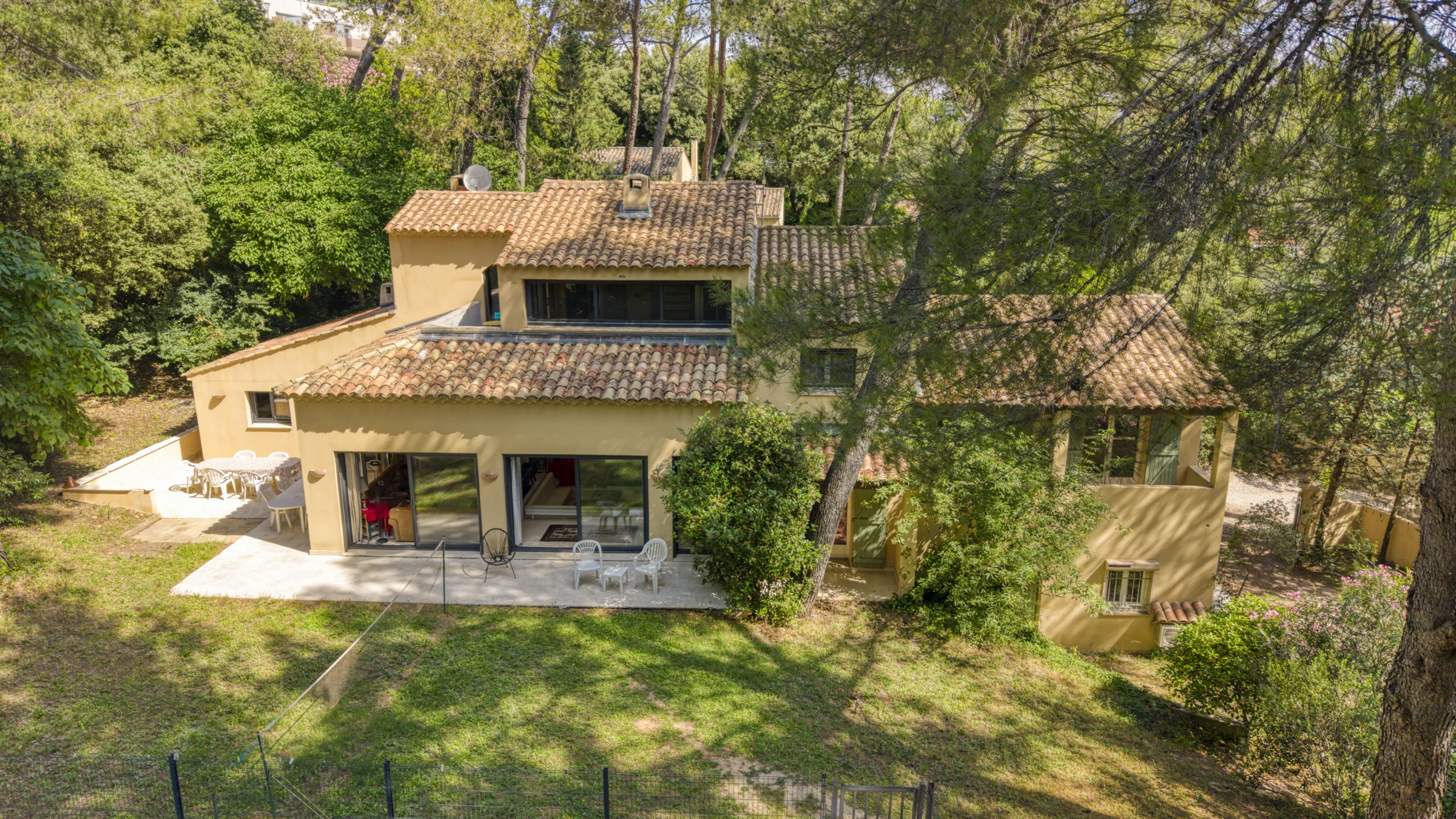 The property surrounded by greenery